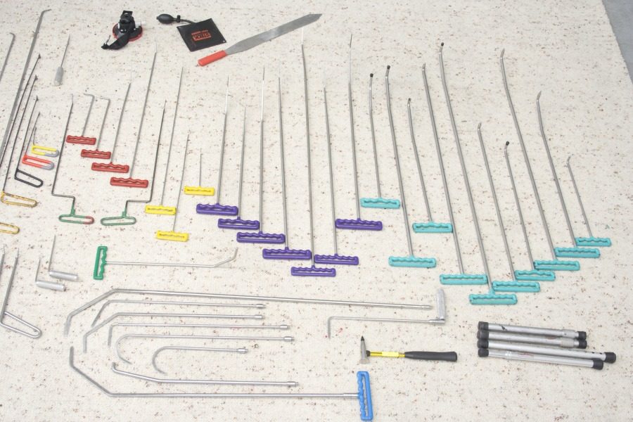 A set of paintless dent repair rods laid out